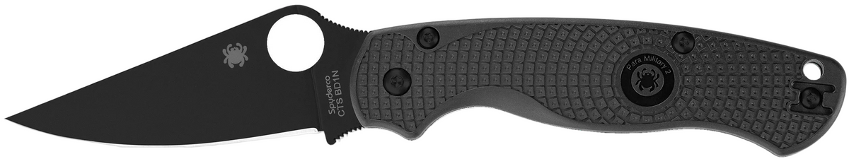 Black folding knife with a G-10 handle on a white background