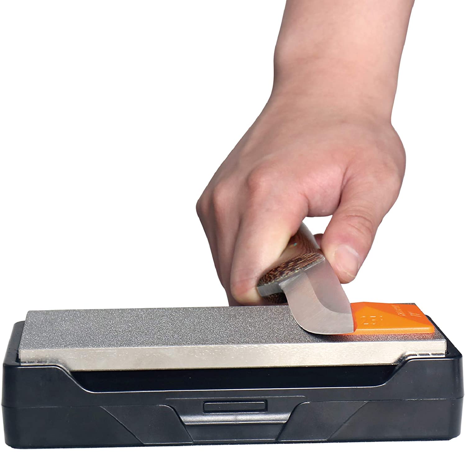 Hand using a knife sharpener with a white background