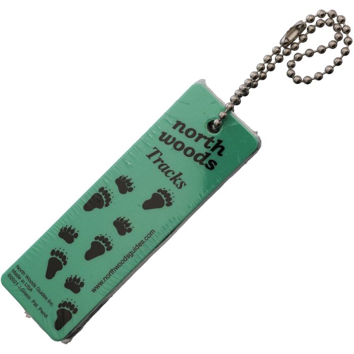 Green keychain with black footprints and 'north woods Tracks' text on a white background