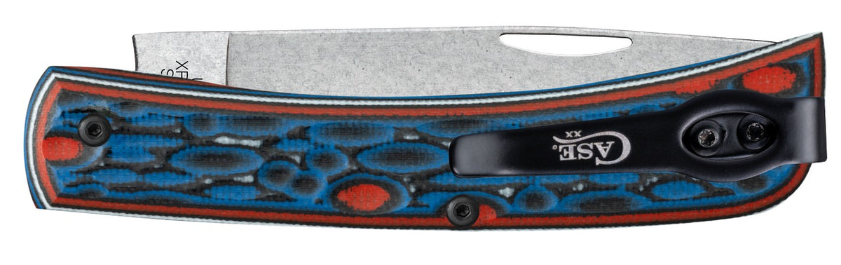 A folding pocket knife with a textured silver steel blade and a handle featuring a blue and red bubbly pattern with a black clip, shown against a plain white background.